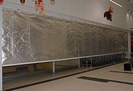 Fire resisting roller curtain